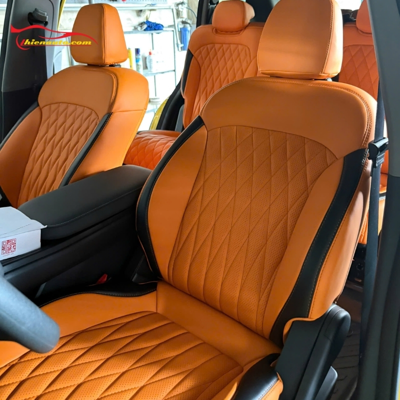 Bọc ghế da ô tô chất liệu nappa đục lỗ CNC màu vàng cam Hèrmes sang trọng